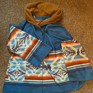 Poncho similar to the one on Yellowstone.  Size fits very generously.  Like new.